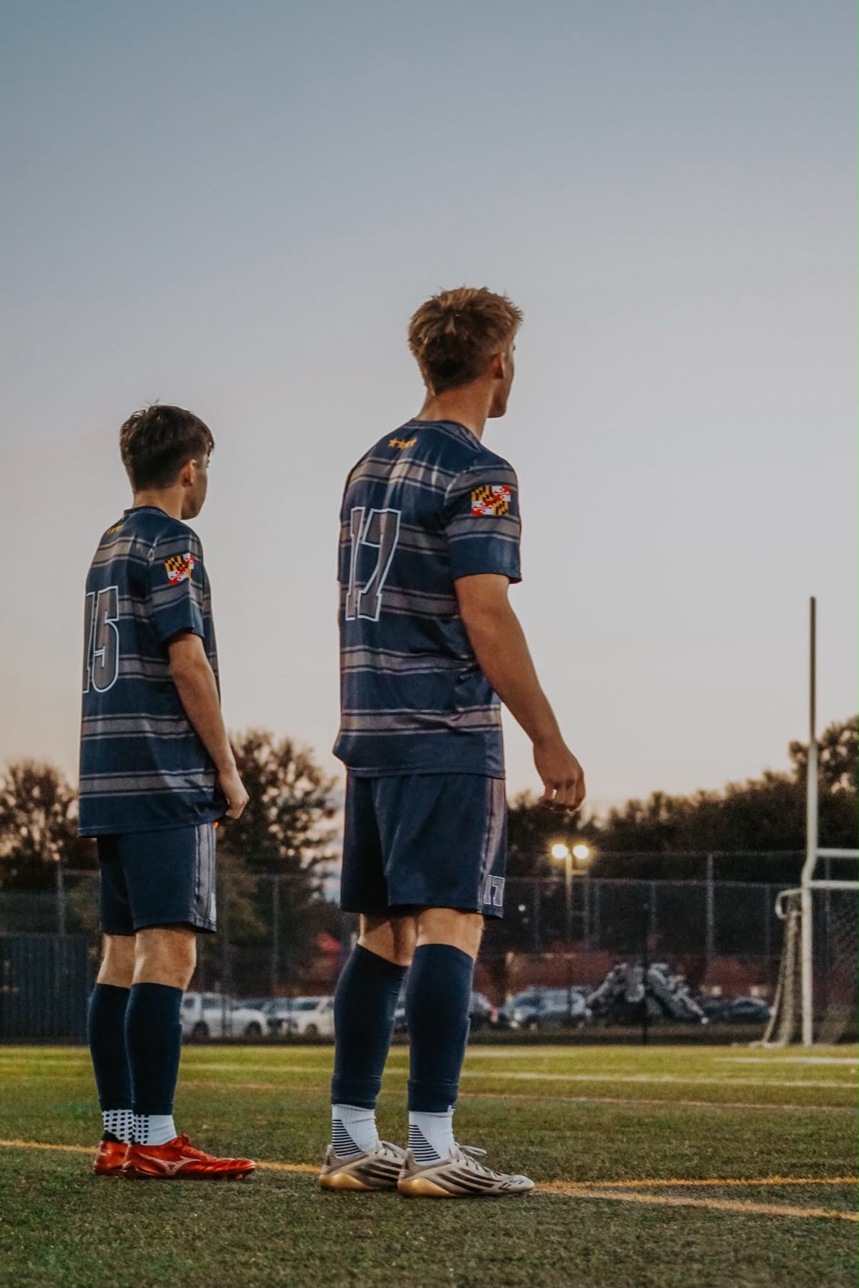 Jake Hammond wearing number 17 with a teammate before a soccer match
